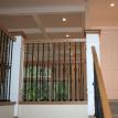 Coffered Ceiling Black Iron Balusters with Stained Railings
